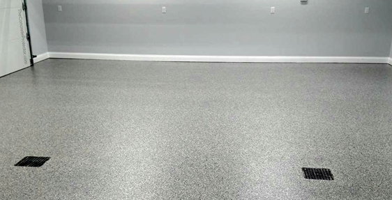 This image shows a garage with a flake epoxy floor.