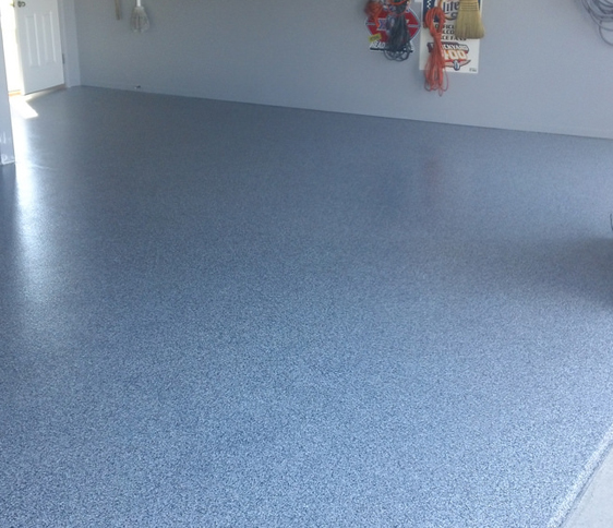 This image shows a garage with a flake epoxy floor.