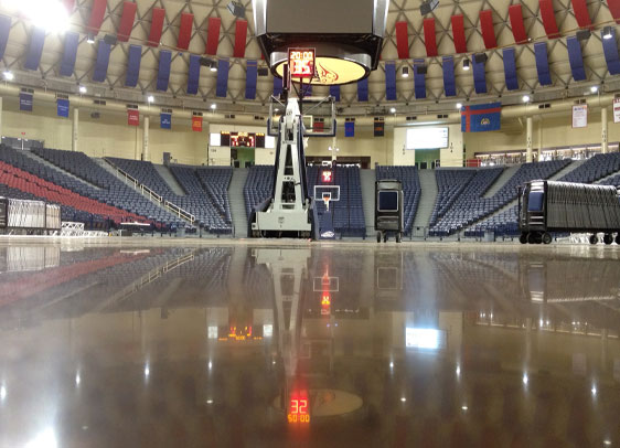 This image shows a basketball court with a shiny floor.