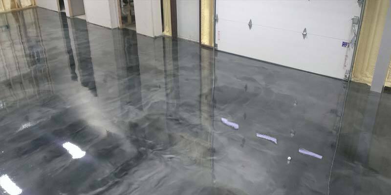 This image shows a commercial space with a metallic epoxy floor.