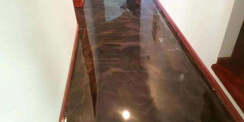 This image shows a commercial space with a metallic epoxy floor.