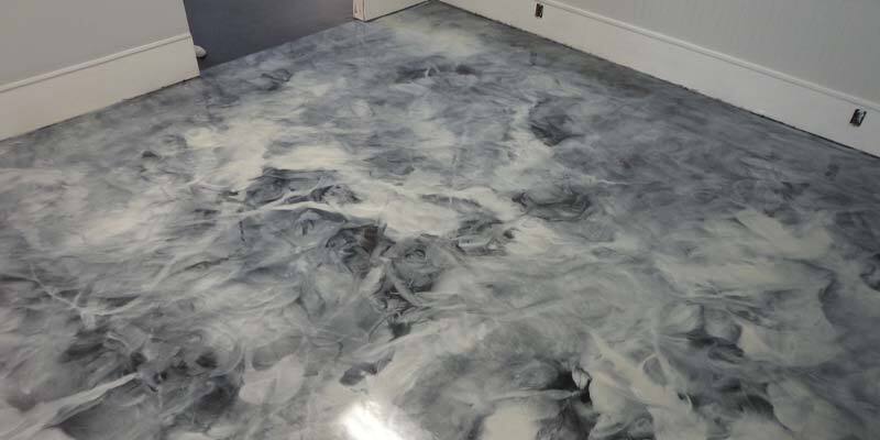 This image shows a commercial space with a metallic epoxy floor.