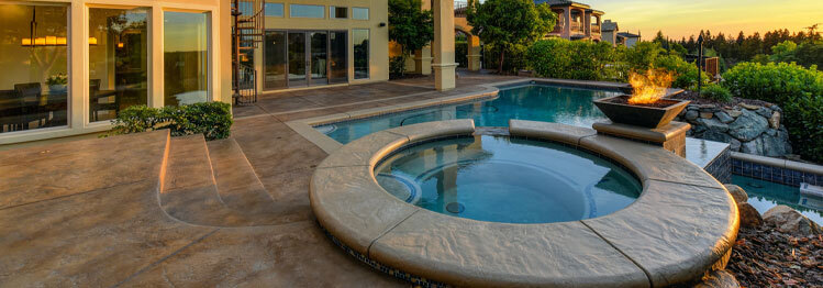 pool-deck-resurfacing This image shows a pool with a newly resurfaced deck.