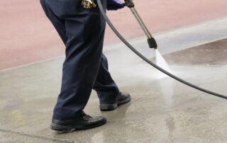 This image shows a man cleaning a floor.